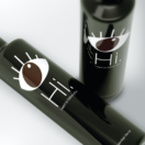 Two bottles of Enios Olive Oil as an example of successful product packaging design