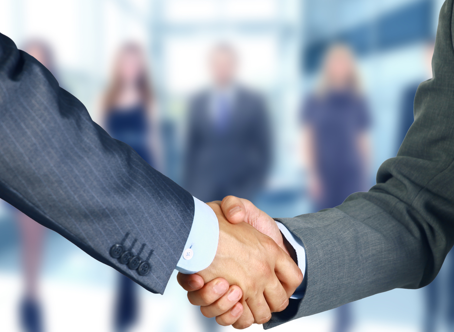Two businessmen shake hands