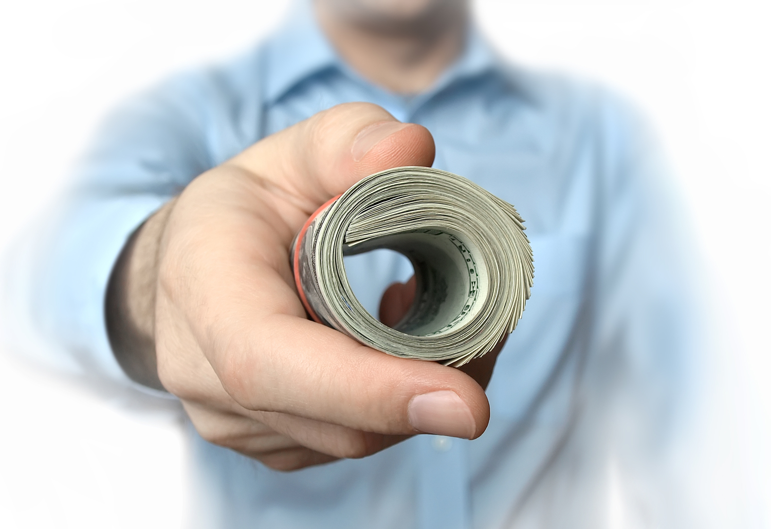 Man Handing Over Roll of Dollars