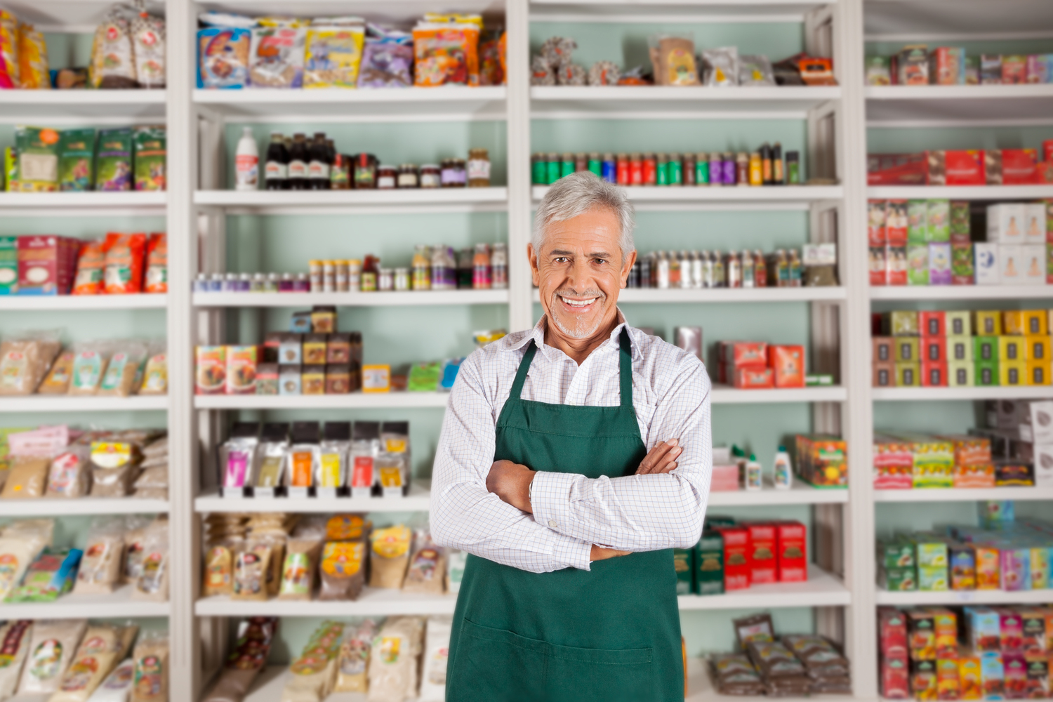 Man in Apron Owns Grocery Store
