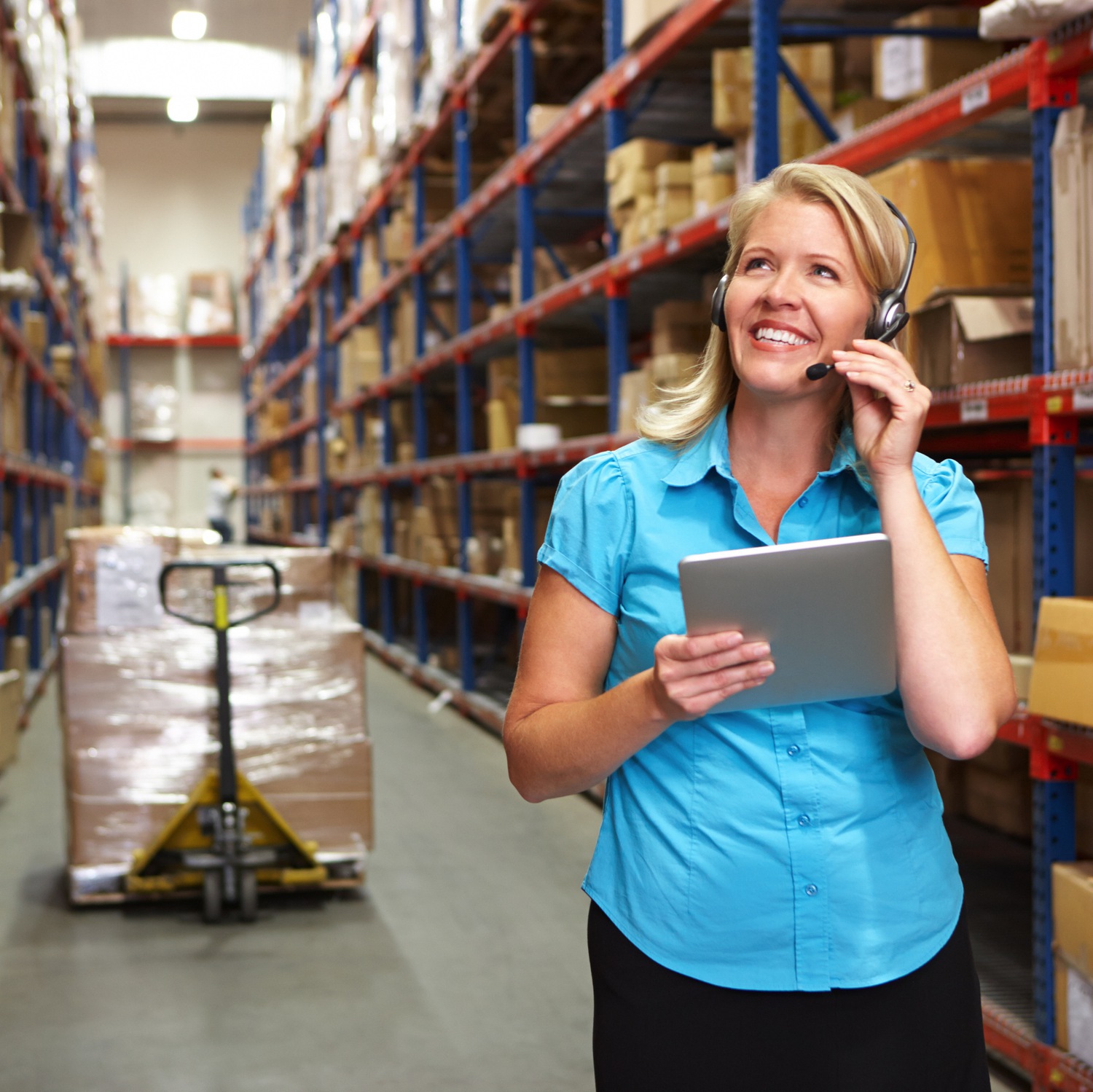 Woman in Warehouse on Tablet square