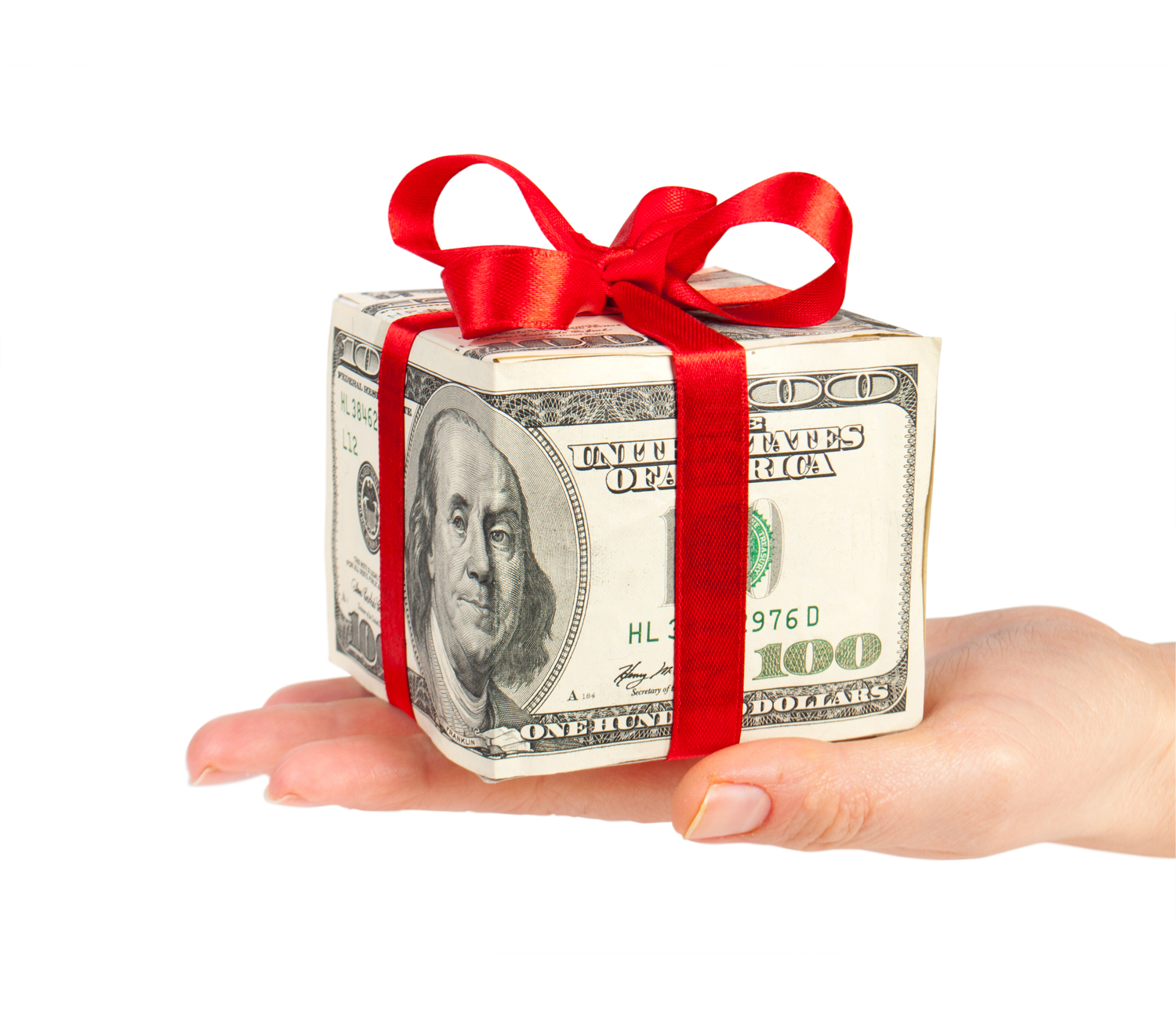 Money box wrapped in red bow in hand