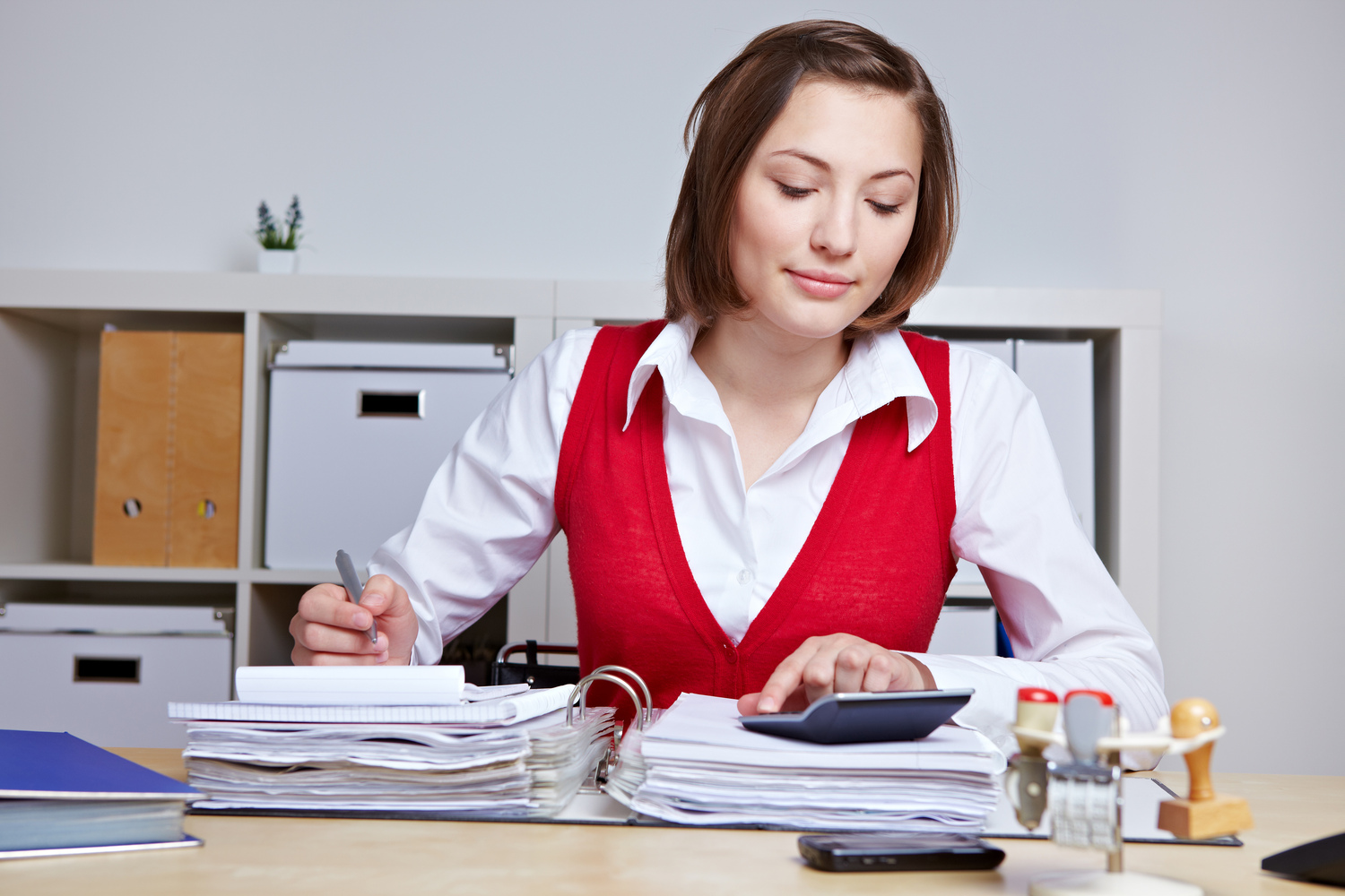 Woman in business casual does a tax audit