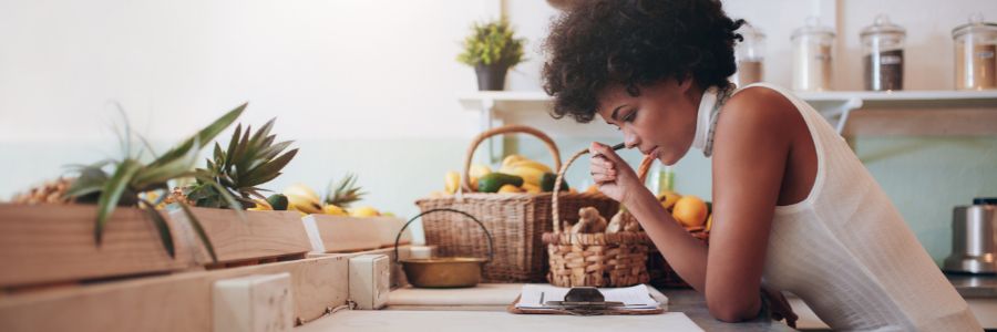 What Does it Take to Be a Successful Entrepreneur? 6 Requirements Explained 1 aspiring female entrepreneur working on a business idea in her home office. Considering what skills and traits she needs to work on to find success.