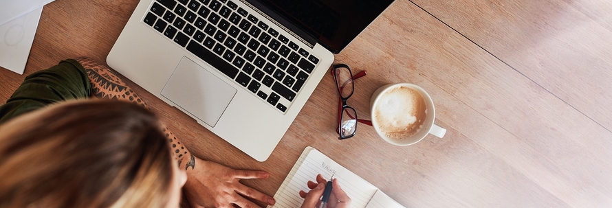 Woman brainstorming at desk; aming your business