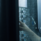 two security professional checking servers for backup