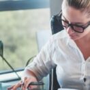 Female entrepreneur working on her business plan in her office. Attempting to decide if a single use or ongoing standing plan makes more sense.